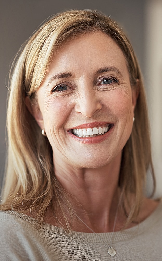 Smiling woman with long blonde hair