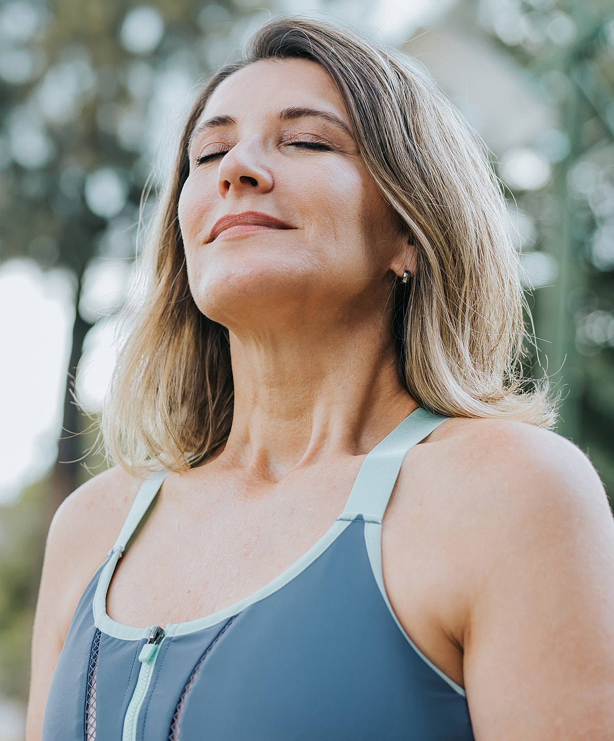 Woman in activewear enjoying the outdoors.