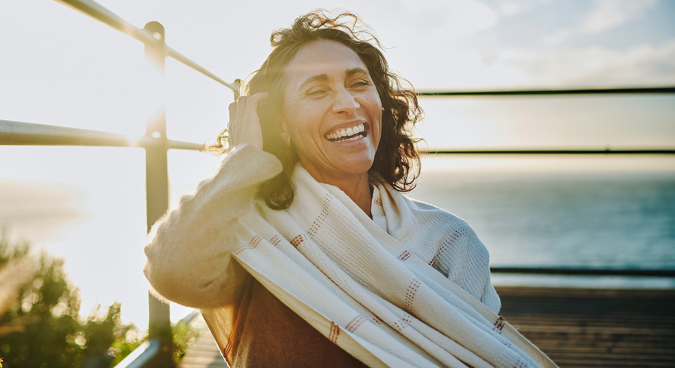 Happy woman enjoying a sunny day outdoors.