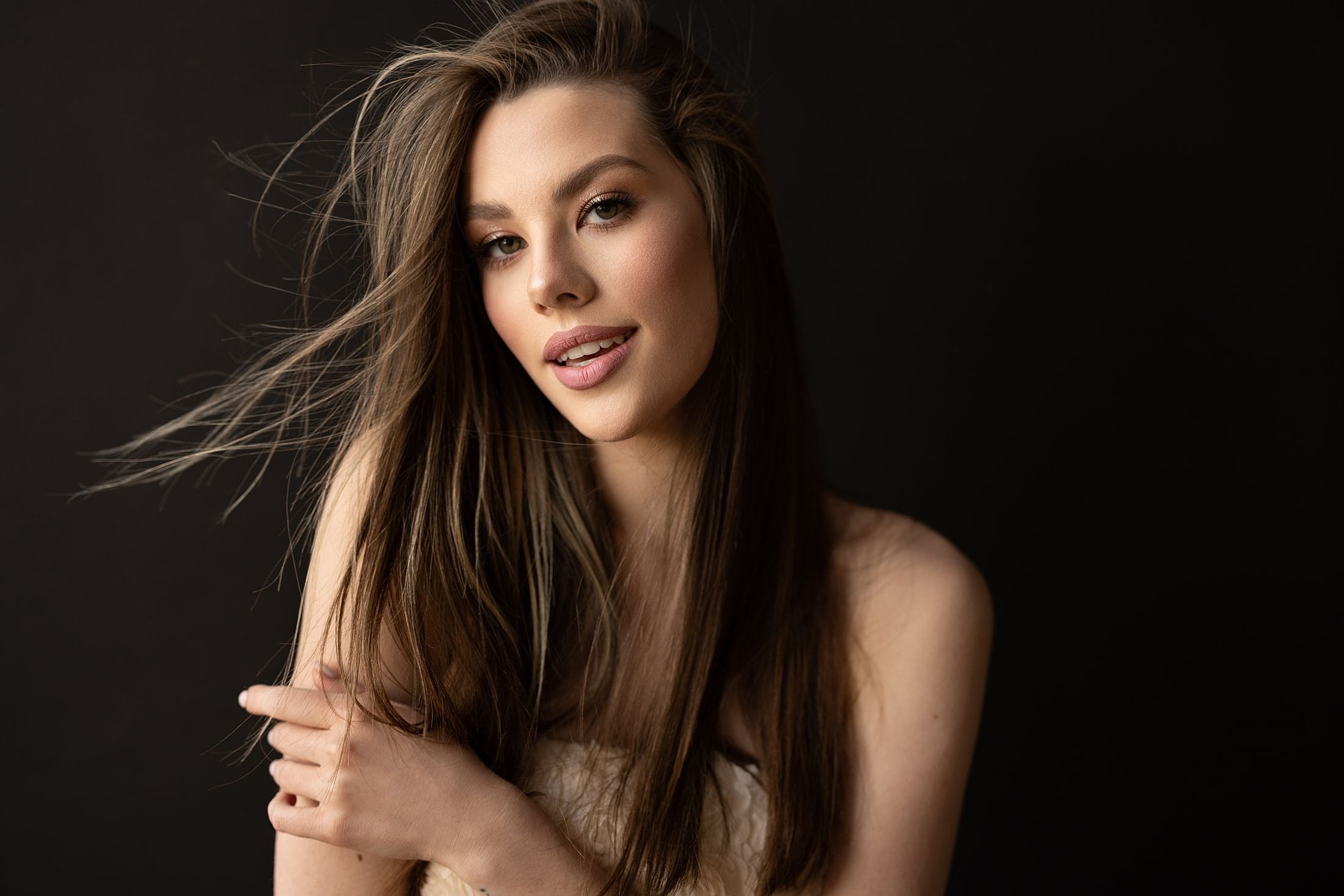 Portrait of a woman with long, flowing hair.