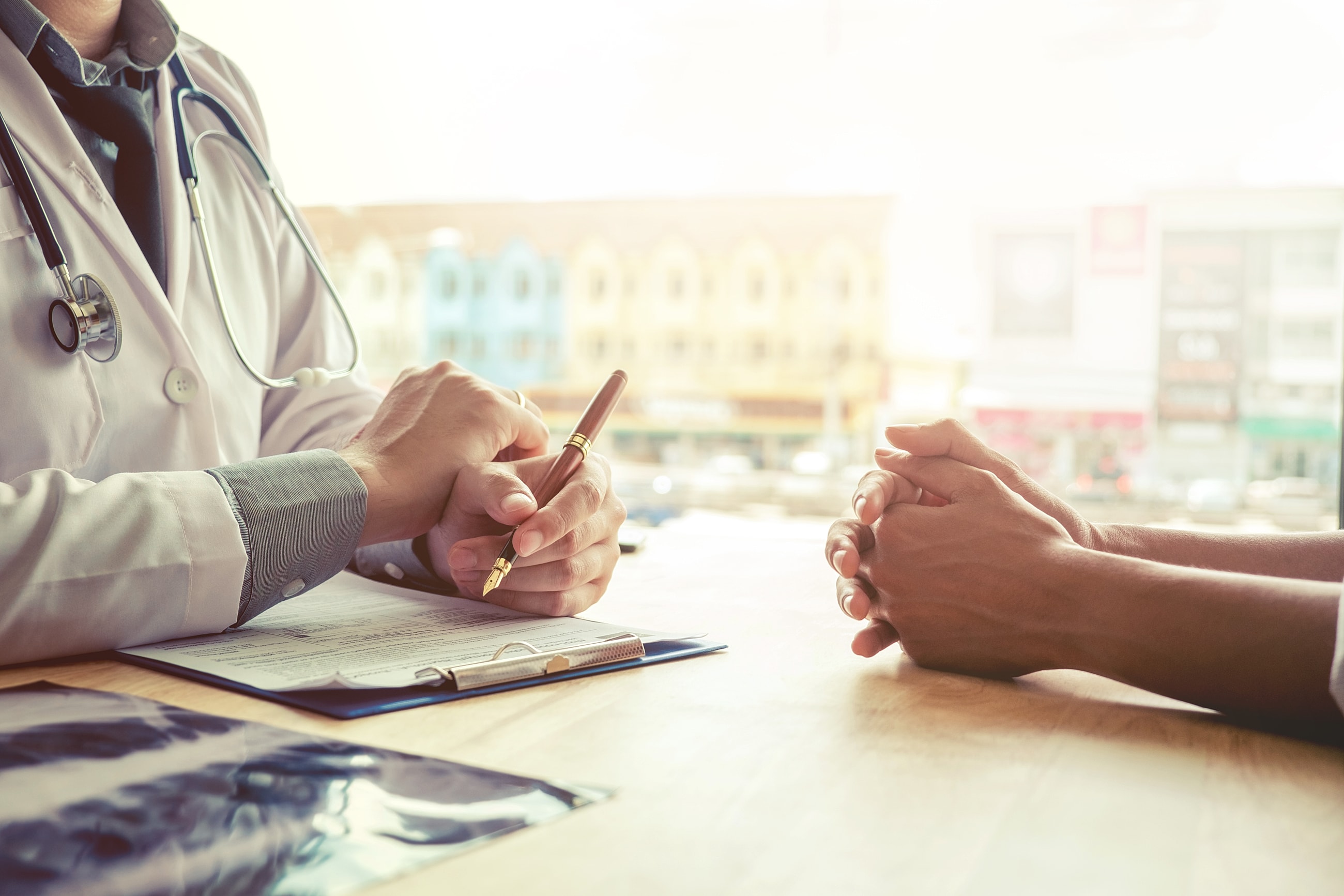 Doctor discussing health with patient.