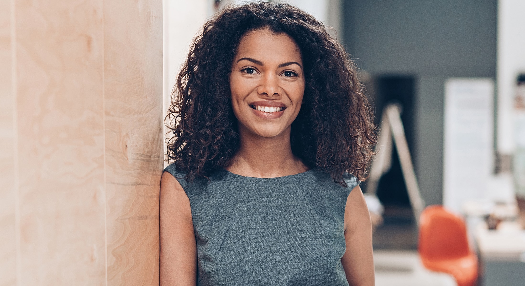 Smiling woman in professional setting.